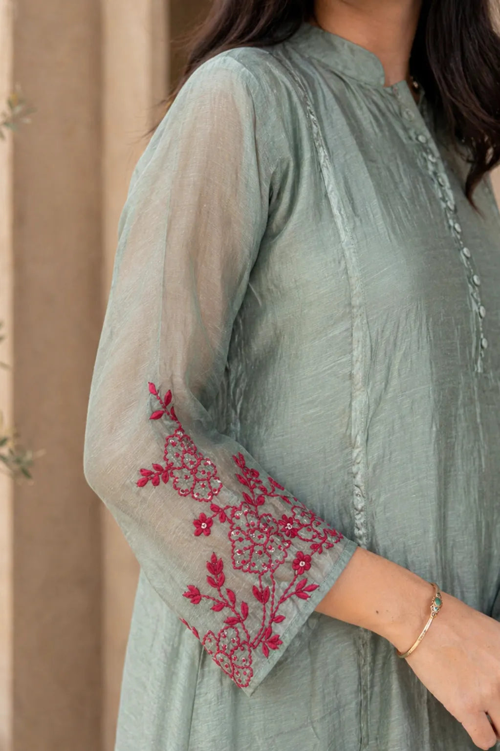 Teal Ruhani mul chanderi A-line suit set with hem embroidery — back view, RITAURA