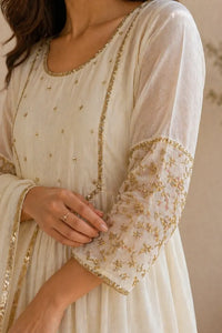 Ivory Aabha mul chanderi A-line suit set with gold neckline — close-up of weave and embroidery detail, RITAURA