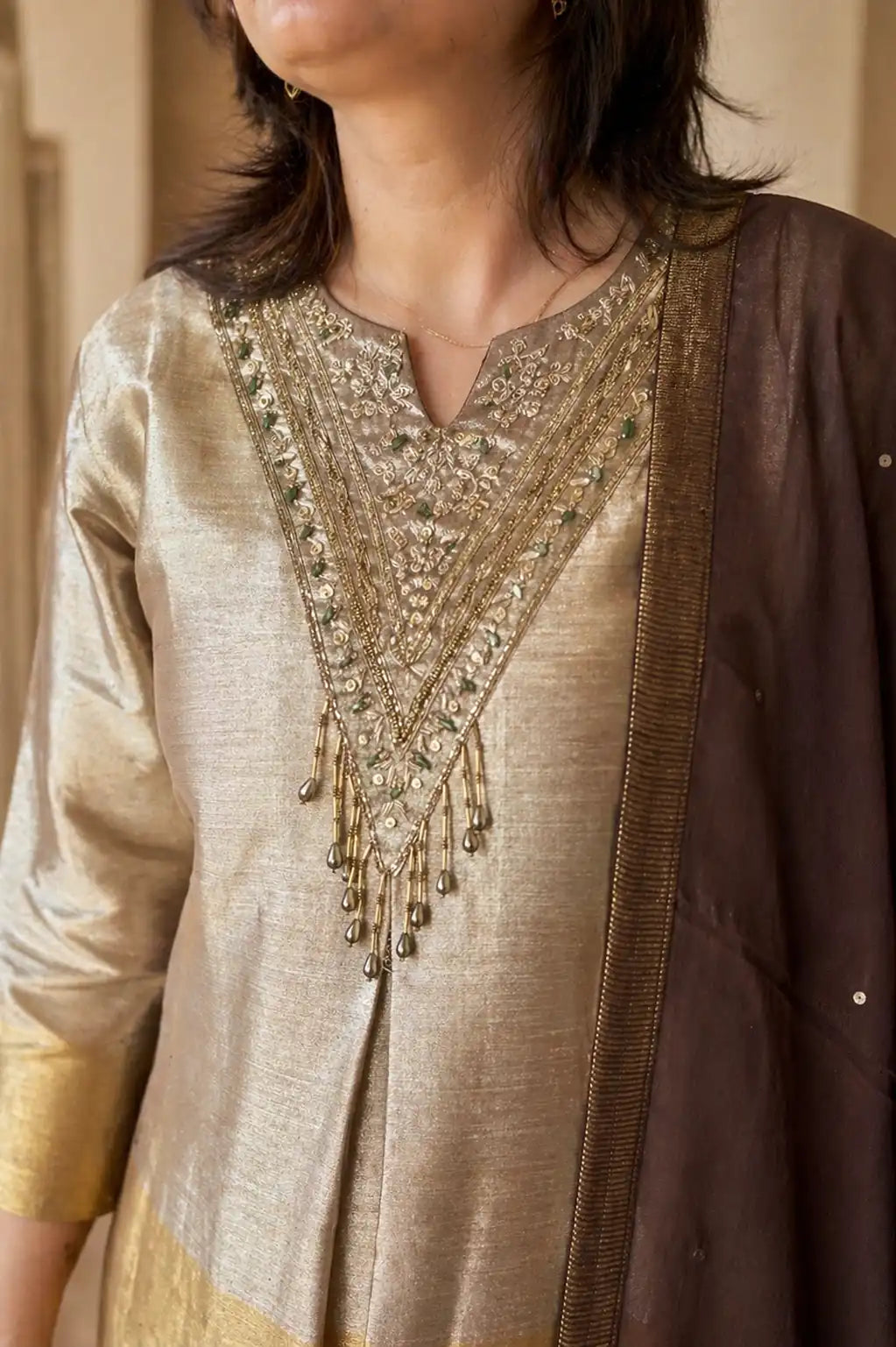 Champagne gold Noor tissue silk suit set with brown embroidery — close-up of weave and embroidery detail, RITAURA