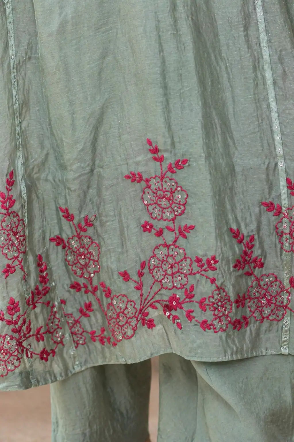Teal Ruhani mul chanderi A-line suit set with hem embroidery — close-up of weave and embroidery detail, RITAURA