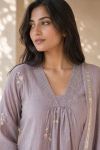 Dusty mauve Gulnaar mul chanderi A-line suit set with embroidery — close-up of weave and embroidery detail, RITAURA