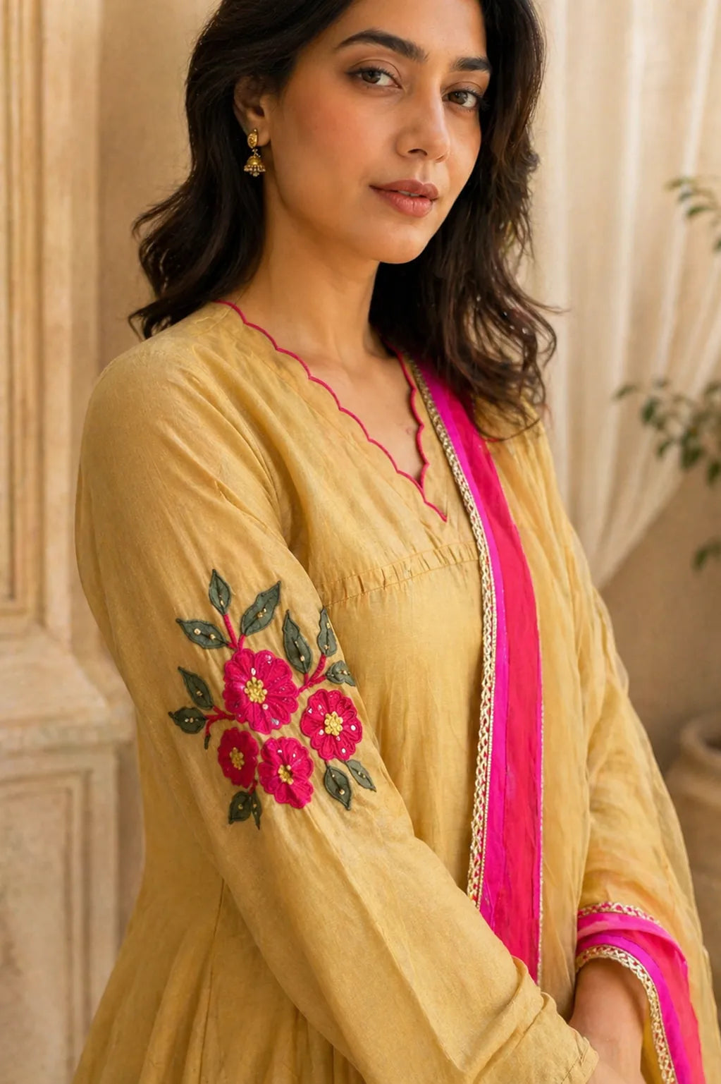 Mustard yellow Aarini mul chanderi A-line suit set with floral embroidery — close-up of weave and embroidery detail, RITAURA