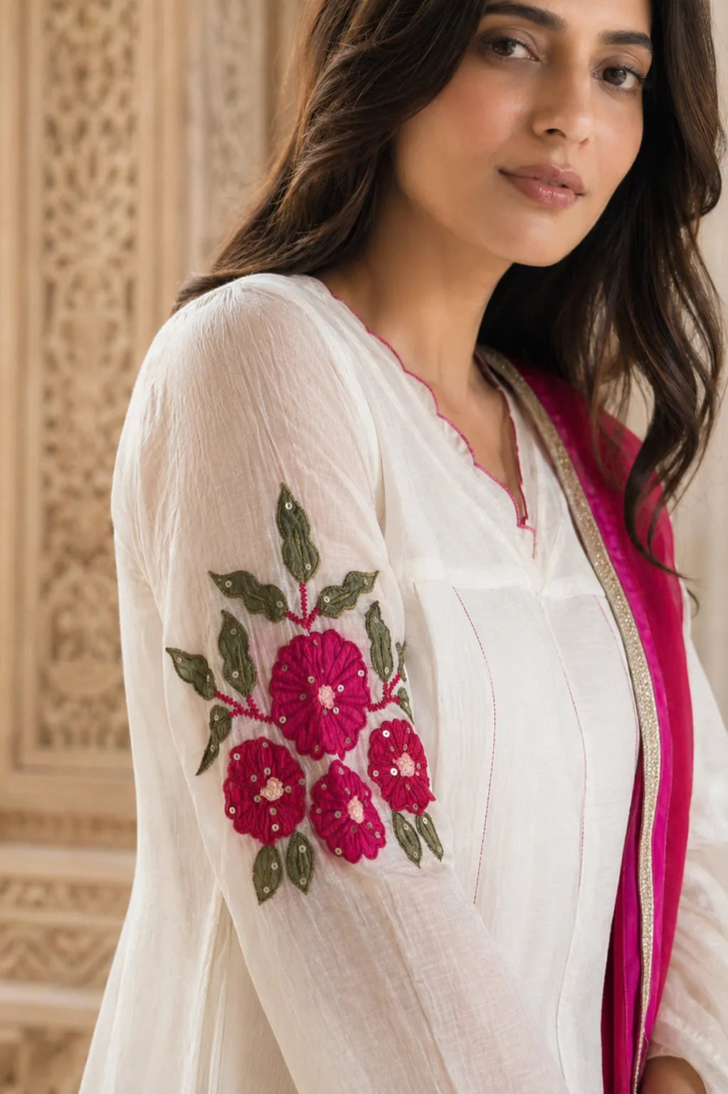 Ivory Aarini mul chanderi A-line suit set with floral sleeve embroidery — close-up of weave and embroidery detail, RITAURA