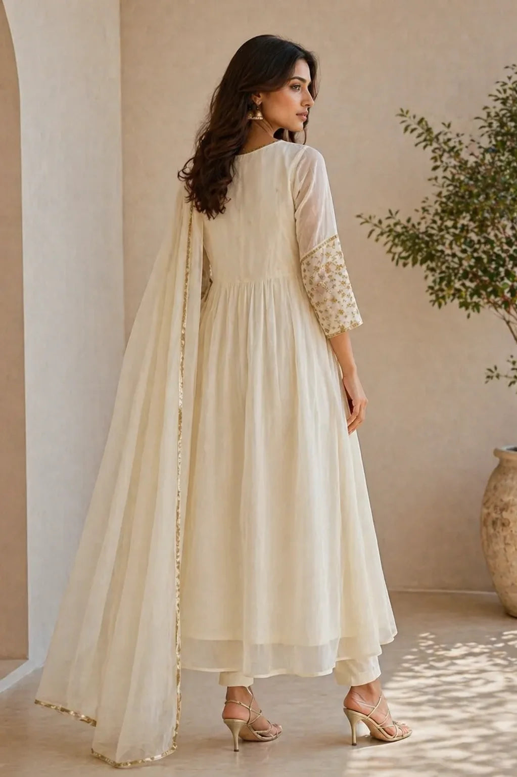 Ivory Aabha mul chanderi A-line suit set with gold neckline — styled look on model, RITAURA