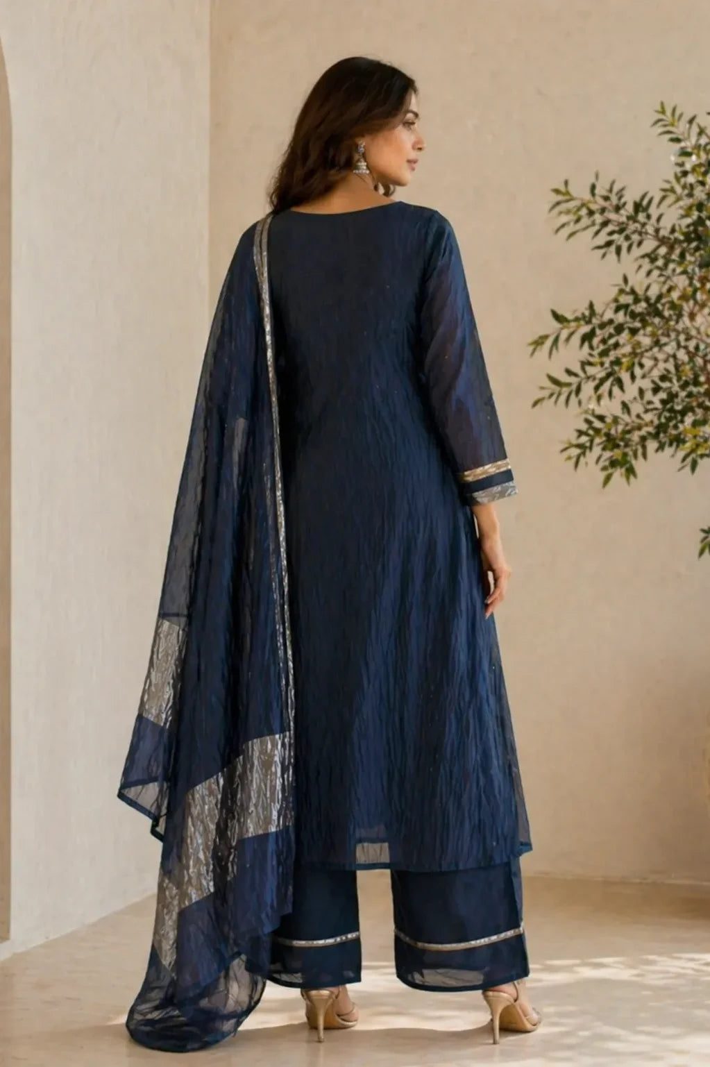 Midnight blue Neel Kamal mul chanderi A-line suit set with gold detail — styled look on model, RITAURA