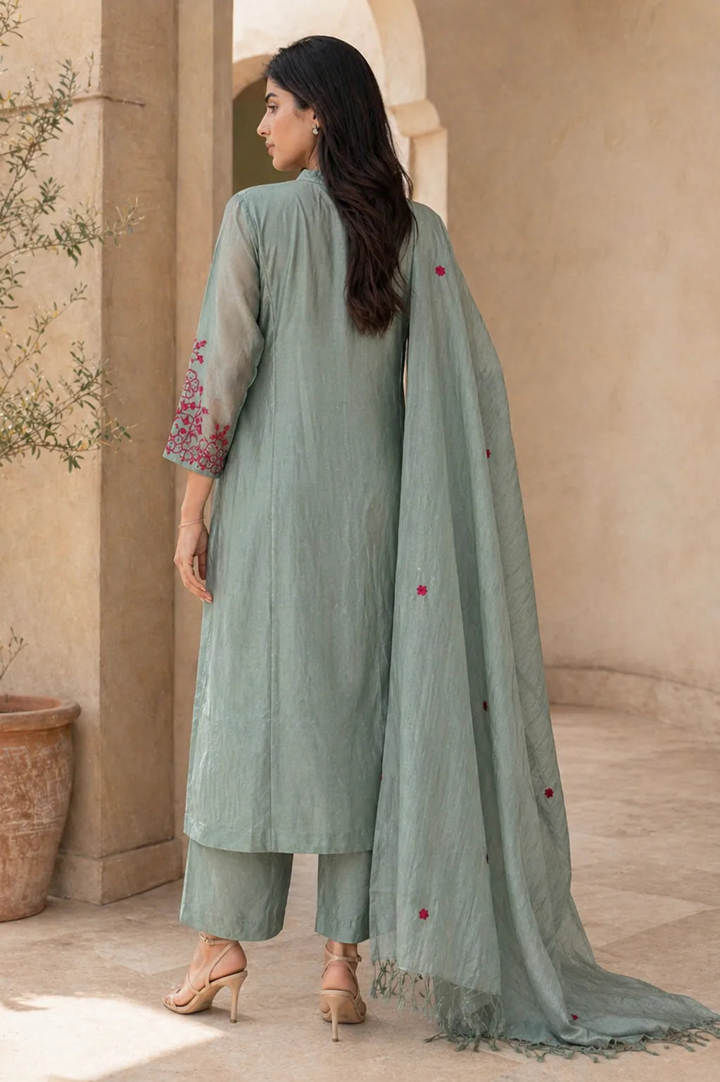 Teal Ruhani mul chanderi A-line suit set with hem embroidery — styled look on model, RITAURA