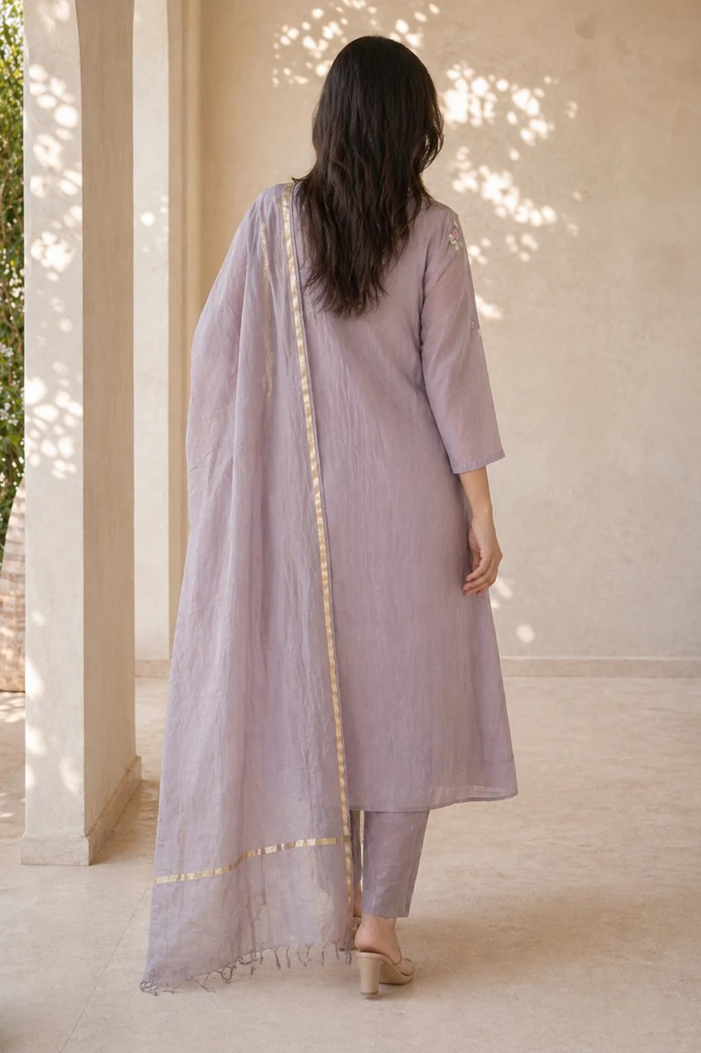 Dusty mauve Gulnaar mul chanderi A-line suit set with embroidery — styled look on model, RITAURA