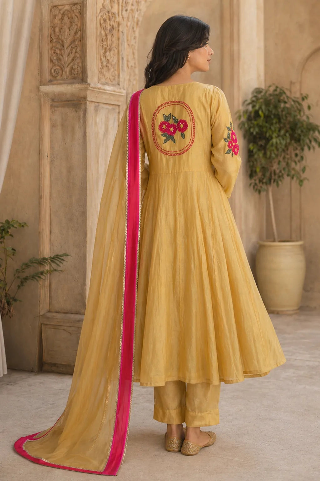 Mustard yellow Aarini mul chanderi A-line suit set with floral embroidery — styled look on model, RITAURA