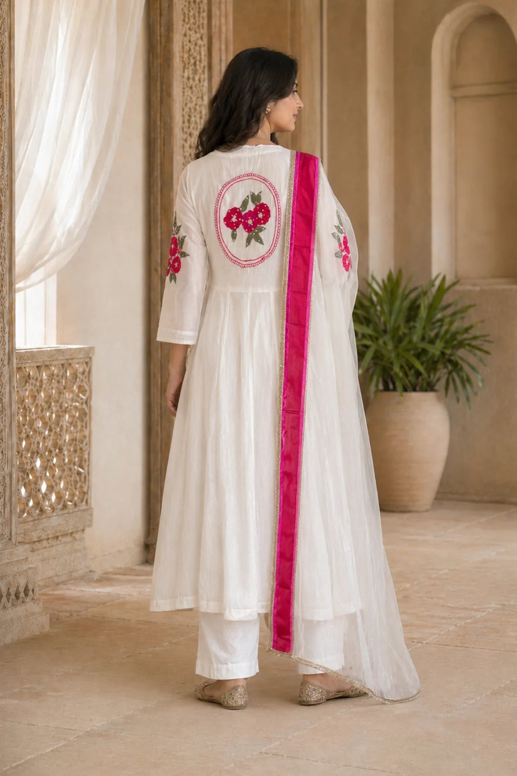 Ivory Aarini mul chanderi A-line suit set with floral sleeve embroidery — styled look on model, RITAURA