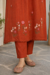 Warm rust Zariya mul cotton suit set with delicate detailing — styled look on model, RITAURA