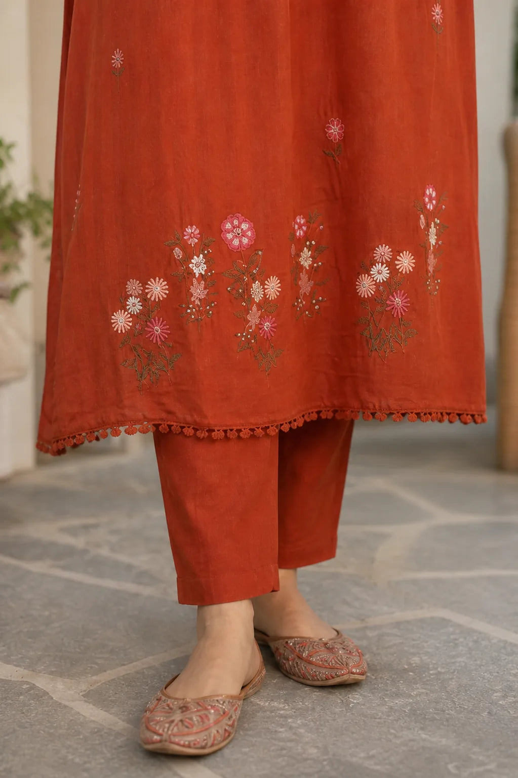 Warm rust Zariya mul cotton suit set with delicate detailing — styled look on model, RITAURA