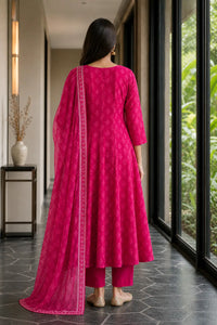 Rani pink Aarohi mul cotton Anarkali suit set with embroidered neckline — styled look on model, RITAURA