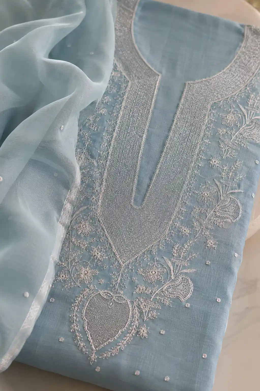 Powder blue Chikankari mal chanderi suit set with hand embroidery — close-up of weave and embroidery detail, RITAURA